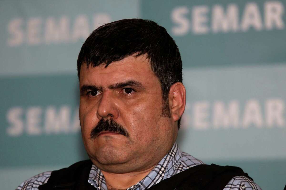 The alleged leader of the Gulf drug cartel, Jorge Eduardo Costilla Sanchez, aka "El Coss," is shown during a media presentation at the Mexican Navy's Center for Advanced Naval Studies in Mexico City,Thursday, Sept. 13, 2012. One of Mexico's most-wanted men, the 41-year-old is charged in the U.S. with drug-trafficking and threatening U.S. law enforcement officials. U.S. authorities offered $5 million for information leading to his arrest. (AP Photo/Dario Lopez-Mills)