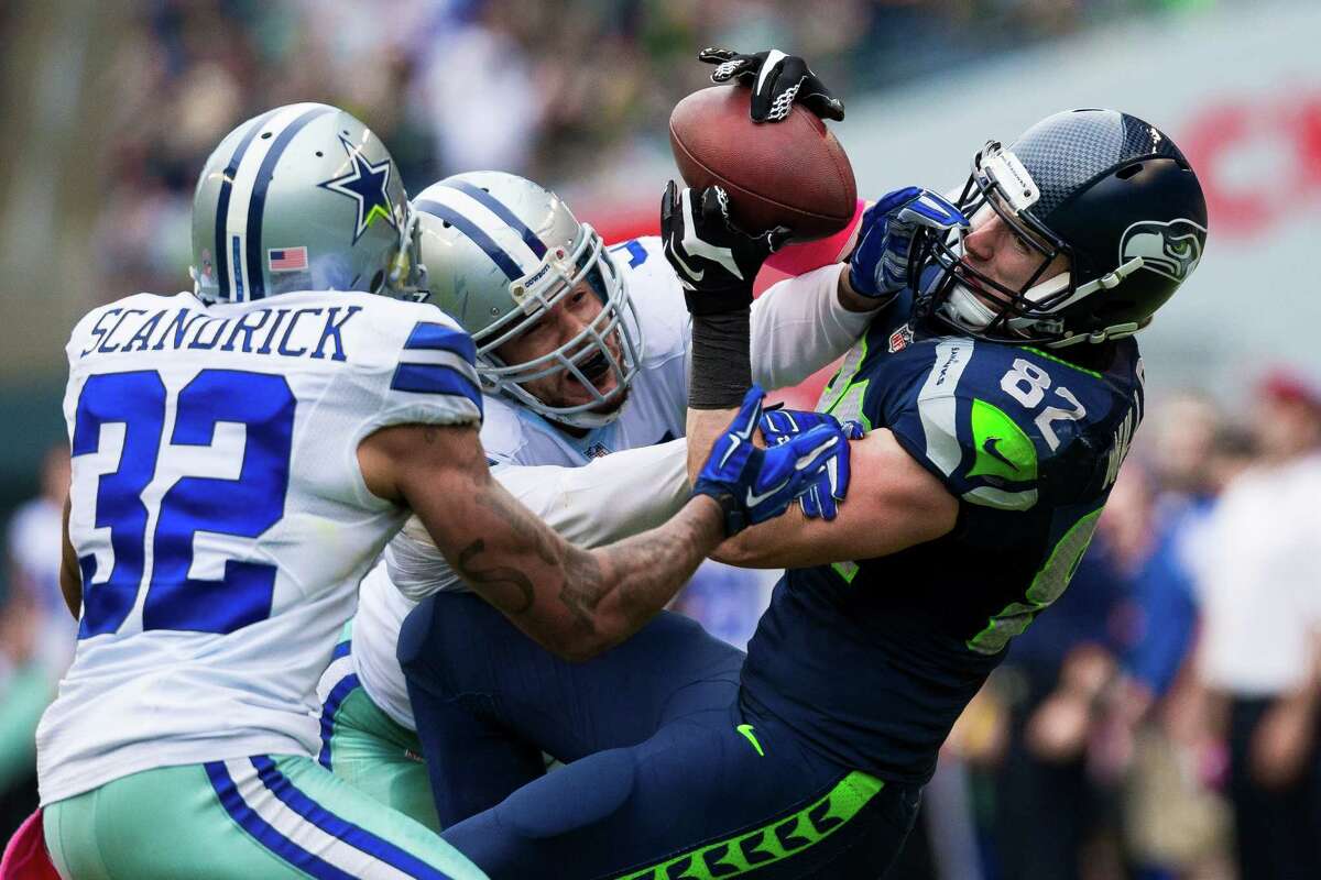 Luke Willson, right, fails to catch a pass during the second half of a game Sunday, October 12, 2014, at CenturyLink Field in Seattle. The Cowboys beat the Seahawks 30-23.