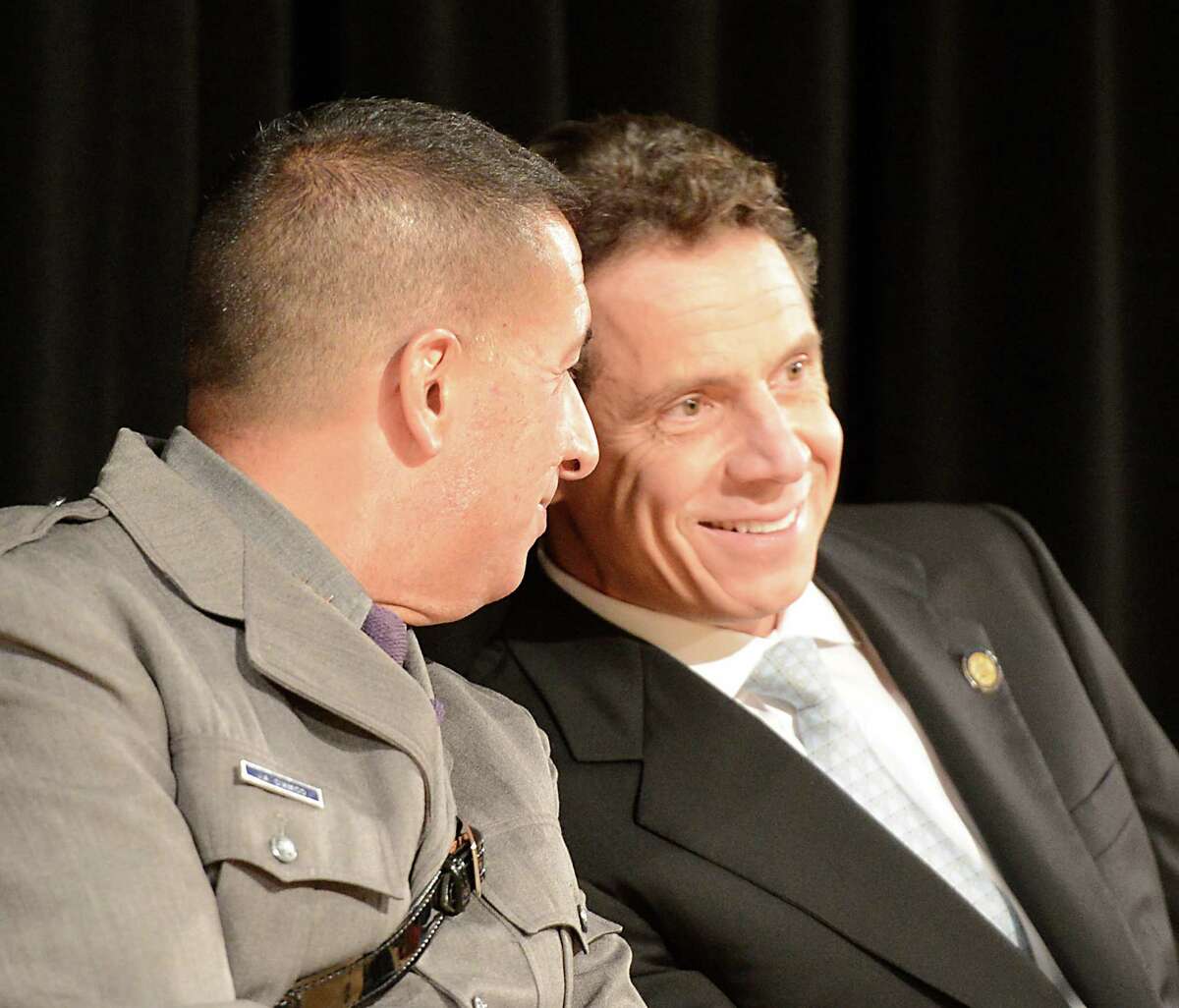 Superintendent Joseph D'Amico, left speaks with Governor Andrew Cuomo at the New York State Police Graduation at the Empire State Plaza Convention Center in Albany, N.Y. Oct 16, 2012. (Skip Dickstein/Times Union)