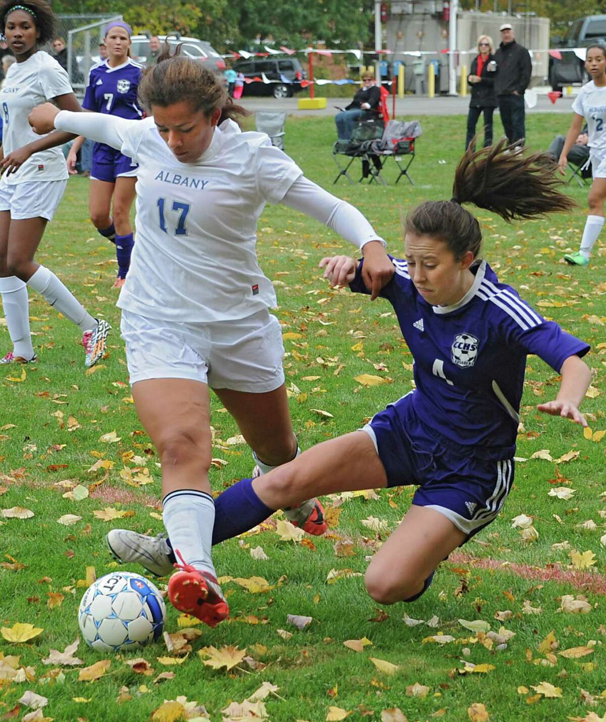 Albany's Isabella Higgins, left, battles for the ball against Catholic Central's Sydney Moss during the girl's championship game on Monday, Oct. 13, 2014 in Castleton-on-Hudson, N.Y. (Lori Van Buren / Times Union)
