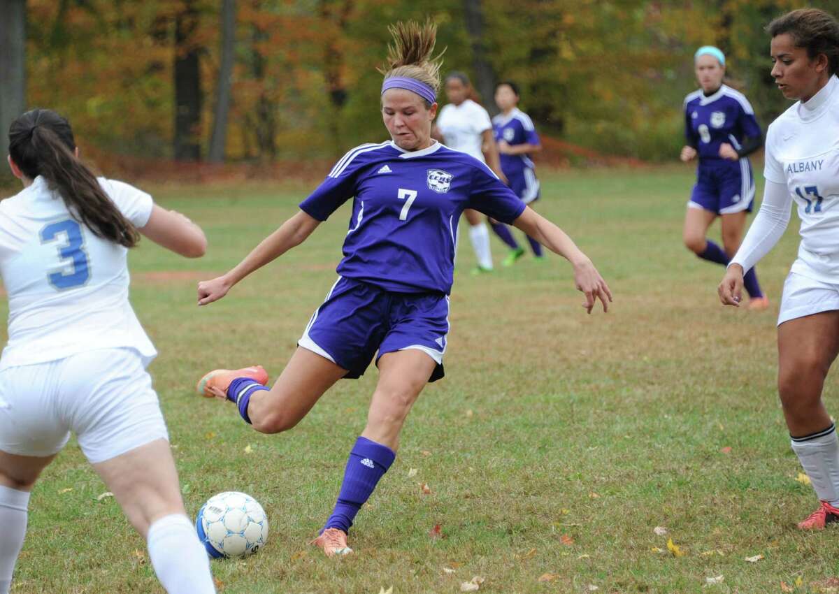 Catholic Central's Madison Purcell kicks the ball past Albany players during the girl's championship game on Monday, Oct. 13, 2014 in Castleton-on-Hudson, N.Y. (Lori Van Buren / Times Union)