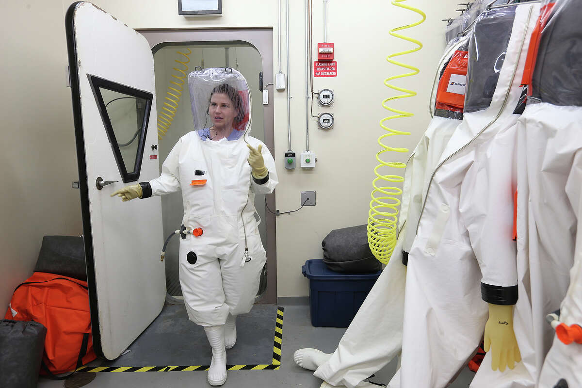 Researcher Dr. Gabi Worwa, DVM, exits the decontamination room of the Biosafety Level-4 lab after working with the Ebola virus at the Texas Biomedical Research Institute, Tuesday, Oct. 14, 2014. The institute has been working on an Ebola vaccine for the past 10 years.