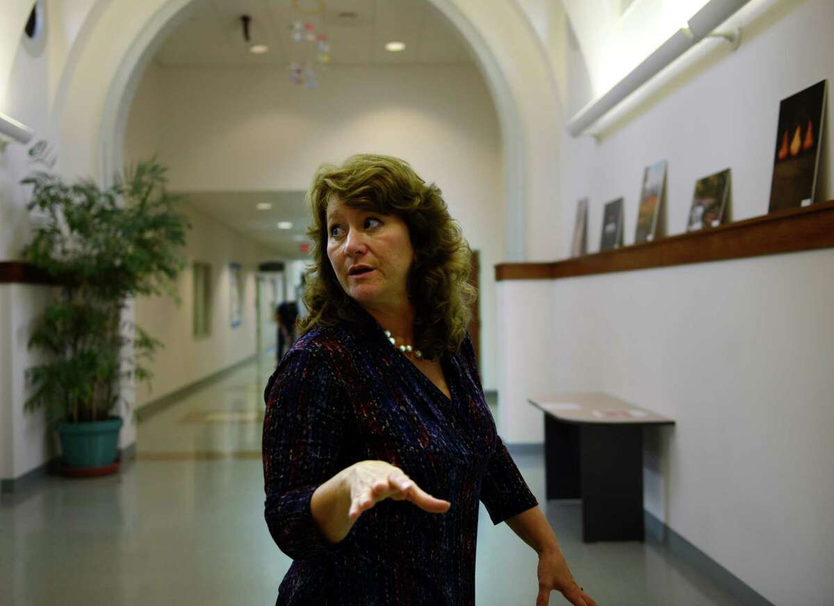 Betsy Paynter, Newtown's Economic Development Coordinator, talks about town projects during an interview at the Municipal Center on the Fairfield Hills campus Tuesday, Oct. 14, 2014.