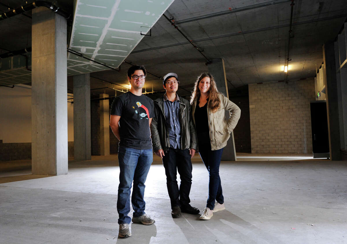 Chef Chris Kiyuna (left) and husband-and-wife restaurateurs Anthony Myint and Karen Leibowitz stand in the space that will become their restaurant, the Perennial, on the ground floor of the AVA building on Ninth Street in San Francisco.