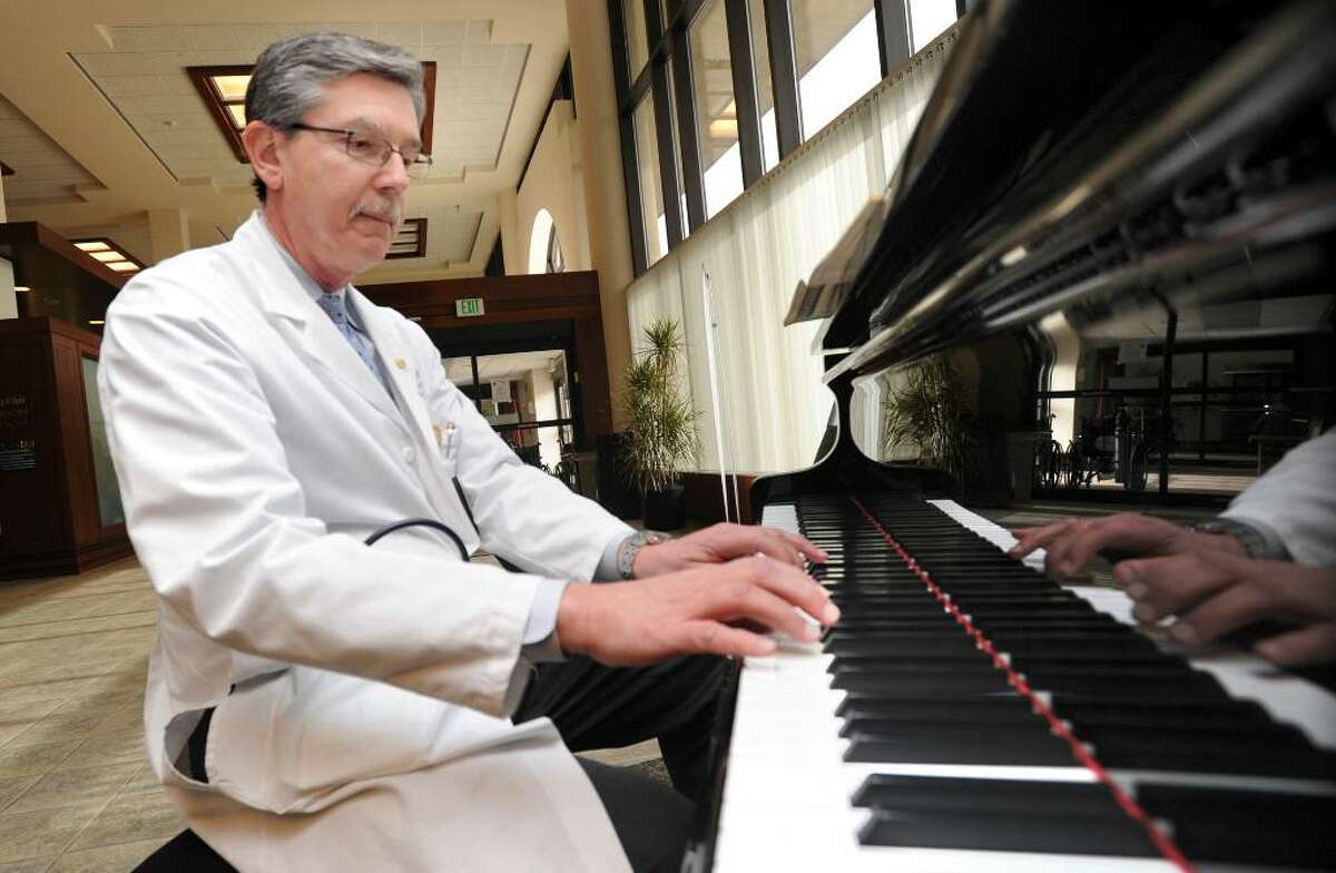 Dr. Robert Kloss, an oncolgist at Danbury Hospital playing the piano Friday, February 5, 2010