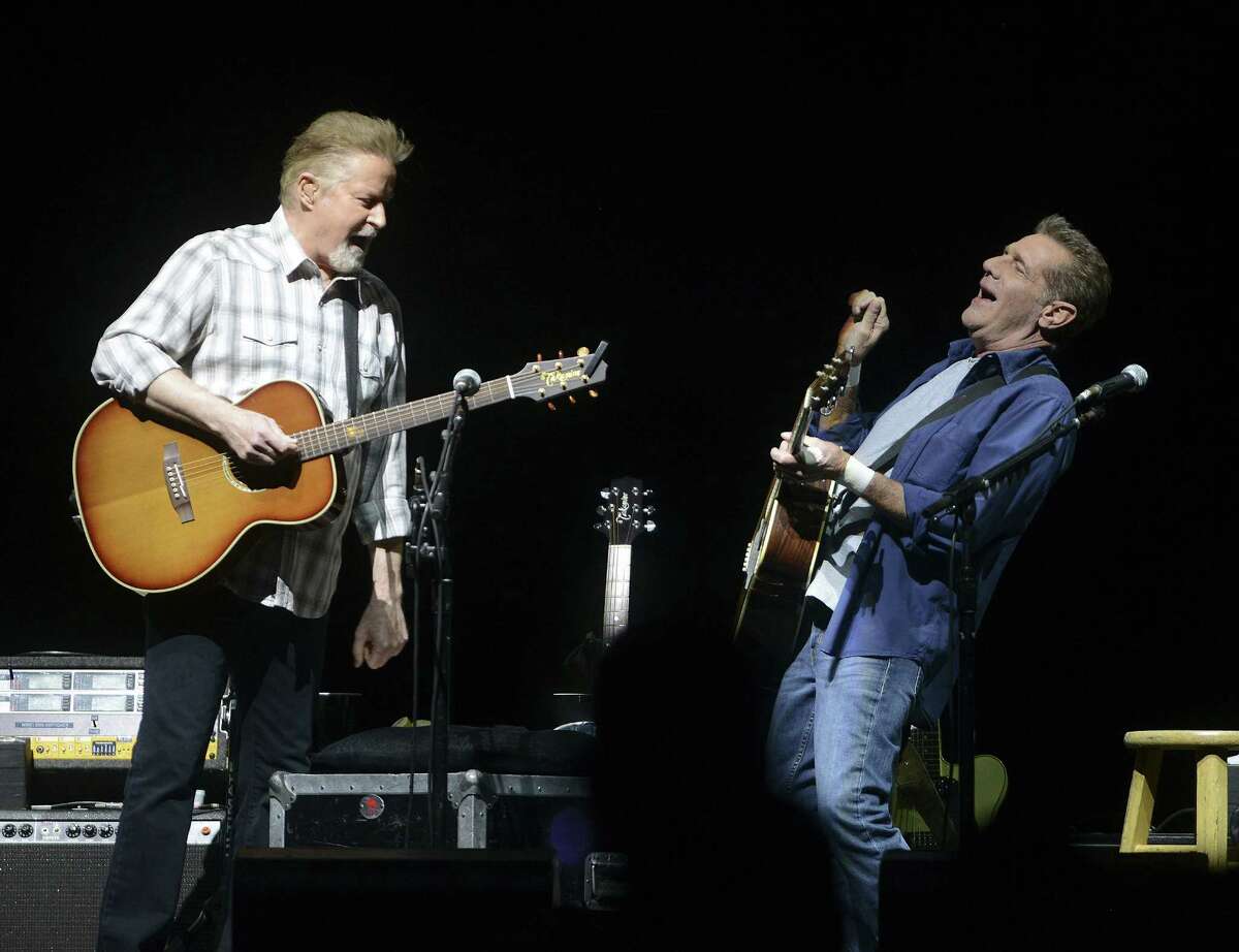 Don Henley, left, and Glenn Frey of the Eagles have a laugh onstage during their "The History of the Eagles" tour stop at the AT&T Center on Wednesday, Oct. 15, 2014.