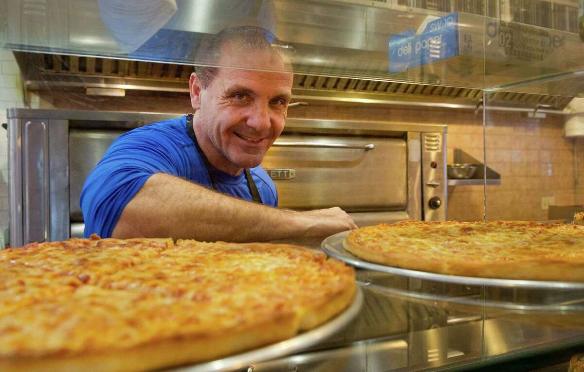 Harry Zopounidis poses for a photo at Pappa's Pizza on Main Street in Stamford, Conn., on Thursday, October 16, 2014. The restaurant is celebrating its 55th birthday.