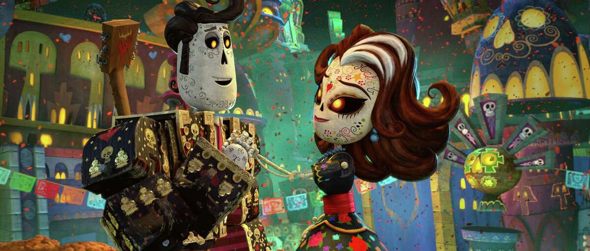 This image released by Twentieth Century Fox shows the characters Manolo, voiced by Diego Luna, left, and Carmen Sanchez, voiced by Ana de la Reguera in a scene from "The Book of Life." (AP Photo/Twentieth Century Fox)