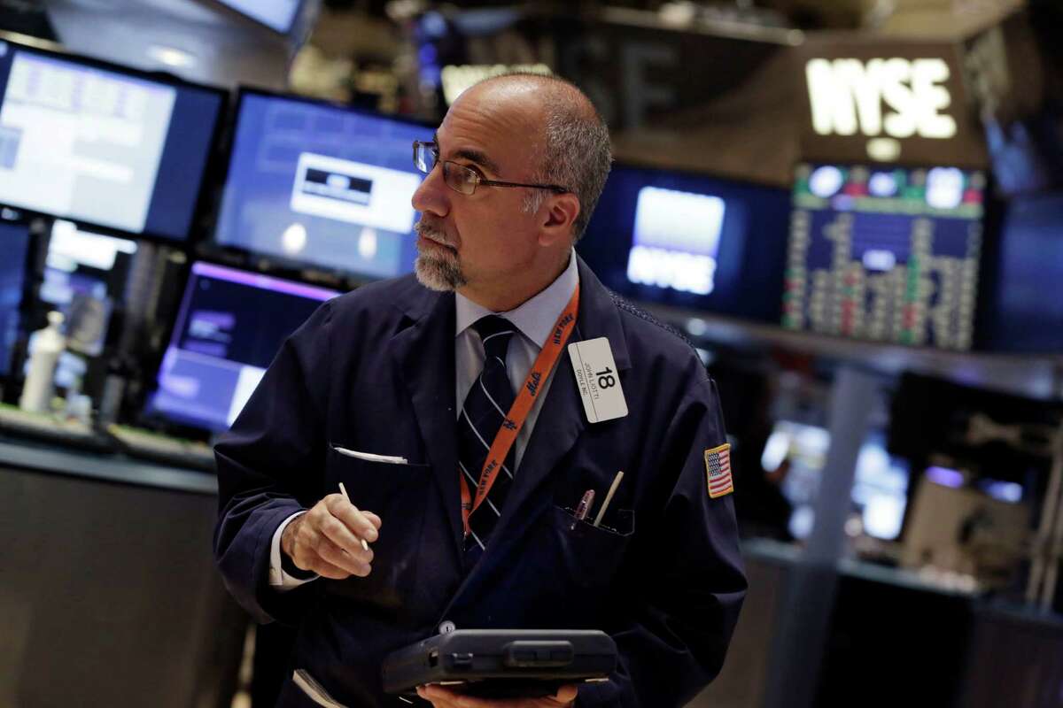 Trader John Liotti works on the floor of the New York Stock Exchange Thursday, Oct. 16, 2014. U.S. stocks opened sharply lower Thursday, following declines in European markets and extending losses from a wild market swing the day before. (AP Photo/Richard Drew)
