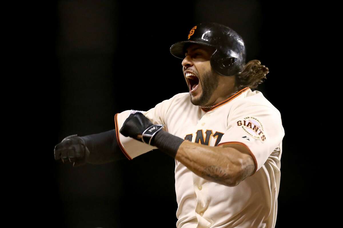 SAN FRANCISCO, CA - OCTOBER 16: Michael Morse #38 of the San Francisco Giants celebrates after hitting a solo home run in the eighth inning against the St. Louis Cardinals during Game Five of the National League Championship Series at AT&T Park on October 16, 2014 in San Francisco, California. (Photo by Christian Petersen/Getty Images)