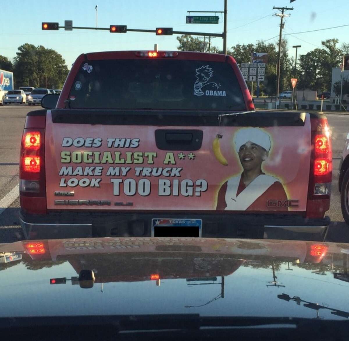 A photo of a truck with Texas tags that features on the tailgate one the most racist decals, complete with a real (and fresh) banana, that targets President Barack Obama was posted to Reddit on Thursday.