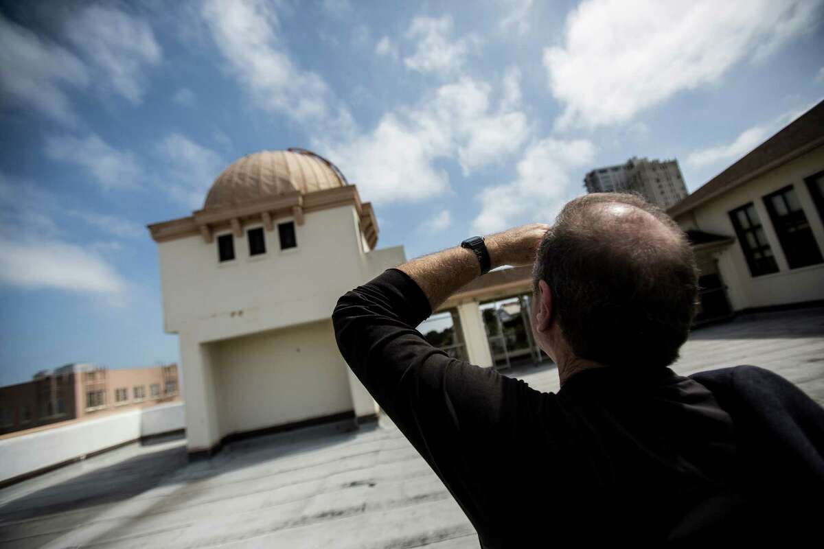 David Goldin, Chief Facilities Officer of the San Francisco Unified School District, views the exterior of the observatory on the roof of Galileo High School. The observatory, built in 1926 by the Galileo Natural History Club, has a revolving dome.