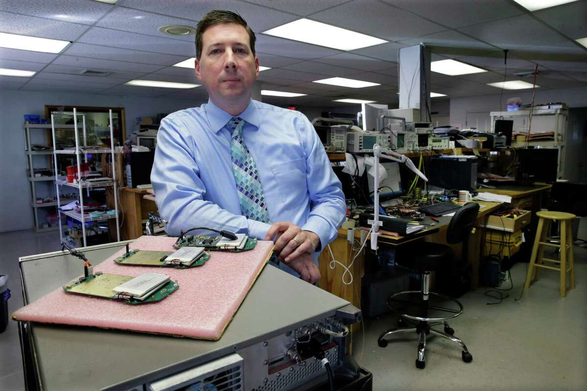 In this Monday, Oct. 6, 2014 photo, company owner Scott Schober stands in a development area at Berkeley Varitronics Systems, in Metuchen, N.J. Berkeley Varitronic Systemsâ bank account was hacked earlier this year and $50,000 was taken, Schober says. He got the money back, but considers the incident a lesson. He had already invested $50,000 in security for his own systems and plans to add another $20,000. (AP Photo/Mel Evans)