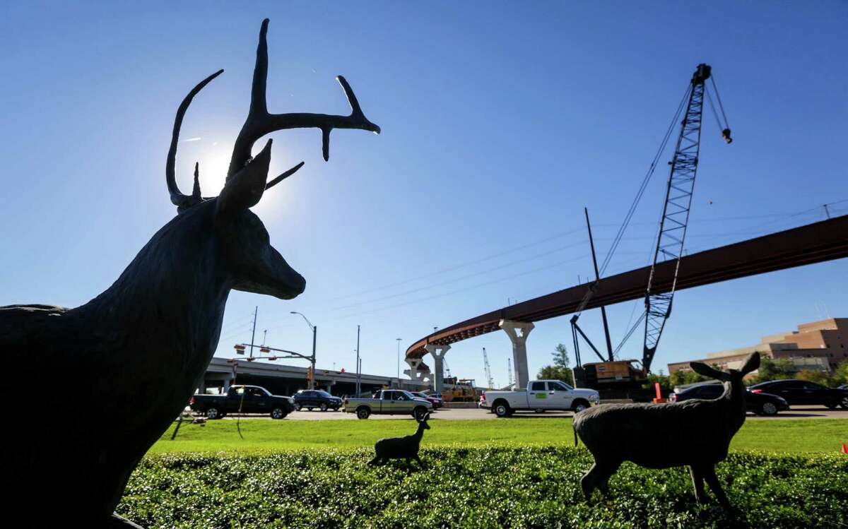 The Woodlands entrance at College Park Drive and Interstate 45 features iconic sculptures of deer - and constant traffic.