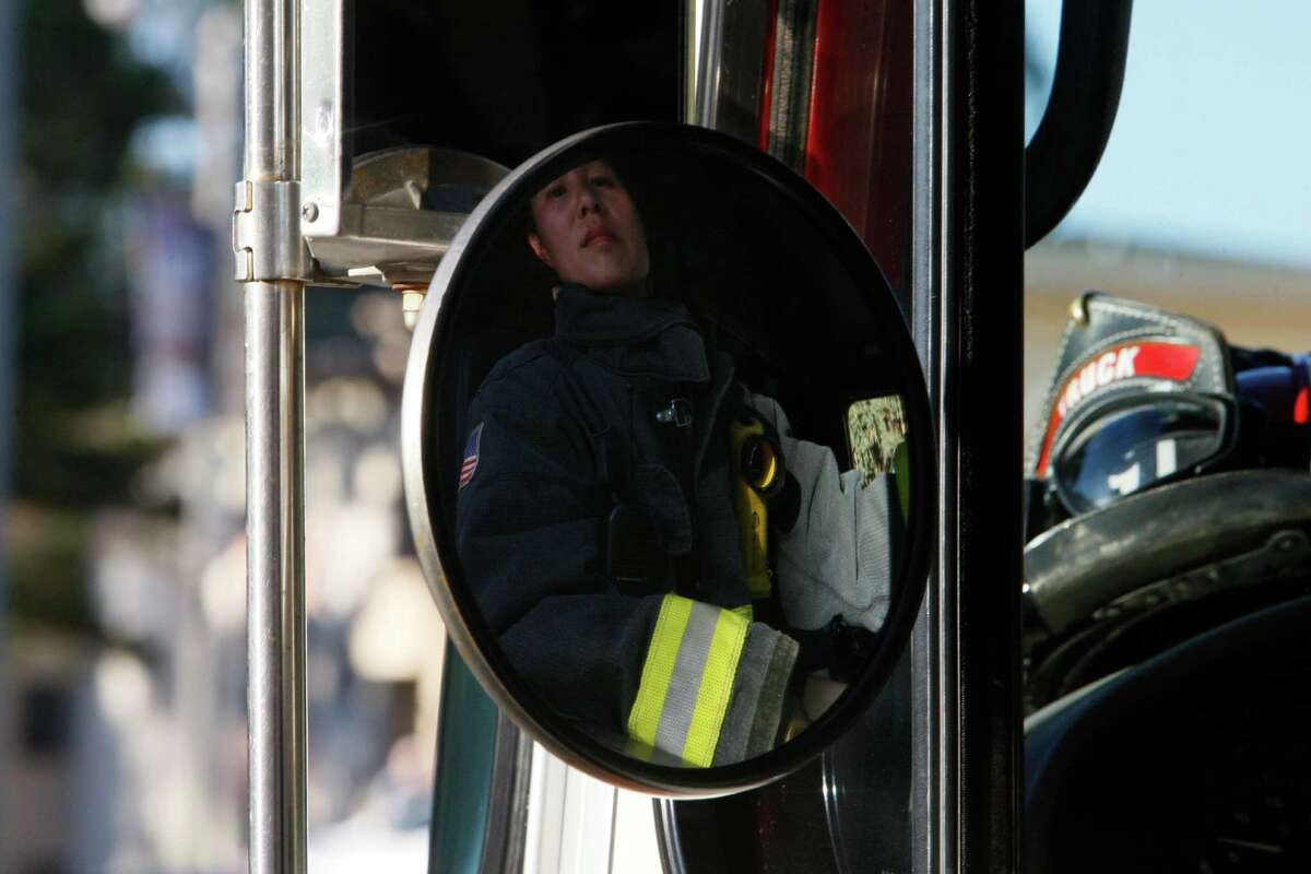 Lt. Patty Lui steers a fire engine into Station 19 in San Francisco on Oct. 18, 2014. Lui is participating in a study to determine whether female firefighters are particularly vulnerable to breast cancer.