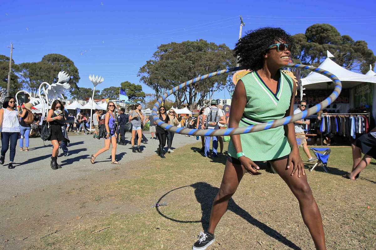Zhalisa Clark of San Francisco hula hoops at the Treasure Island Music Festival on Treasure Island in San Francisco, Calif. Saturday, October 18, 2014