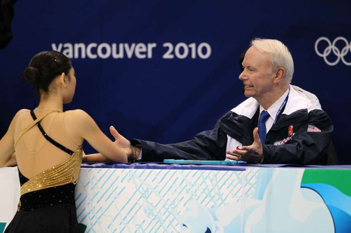 VANCOUVER, BC - FEBRUARY 23: Mirai Nagasu (L) of the United States confers with her coach Frank Carroll in the Ladies Short Program Figure Skating on day 12 of the 2010 Vancouver Winter Olympics at Pacific Coliseum on February 23, 2010 in Vancouver, Canada. (Photo by Matthew Stockman/Getty Images) *** Local Caption *** Mirai Nagasu;Frank Carroll