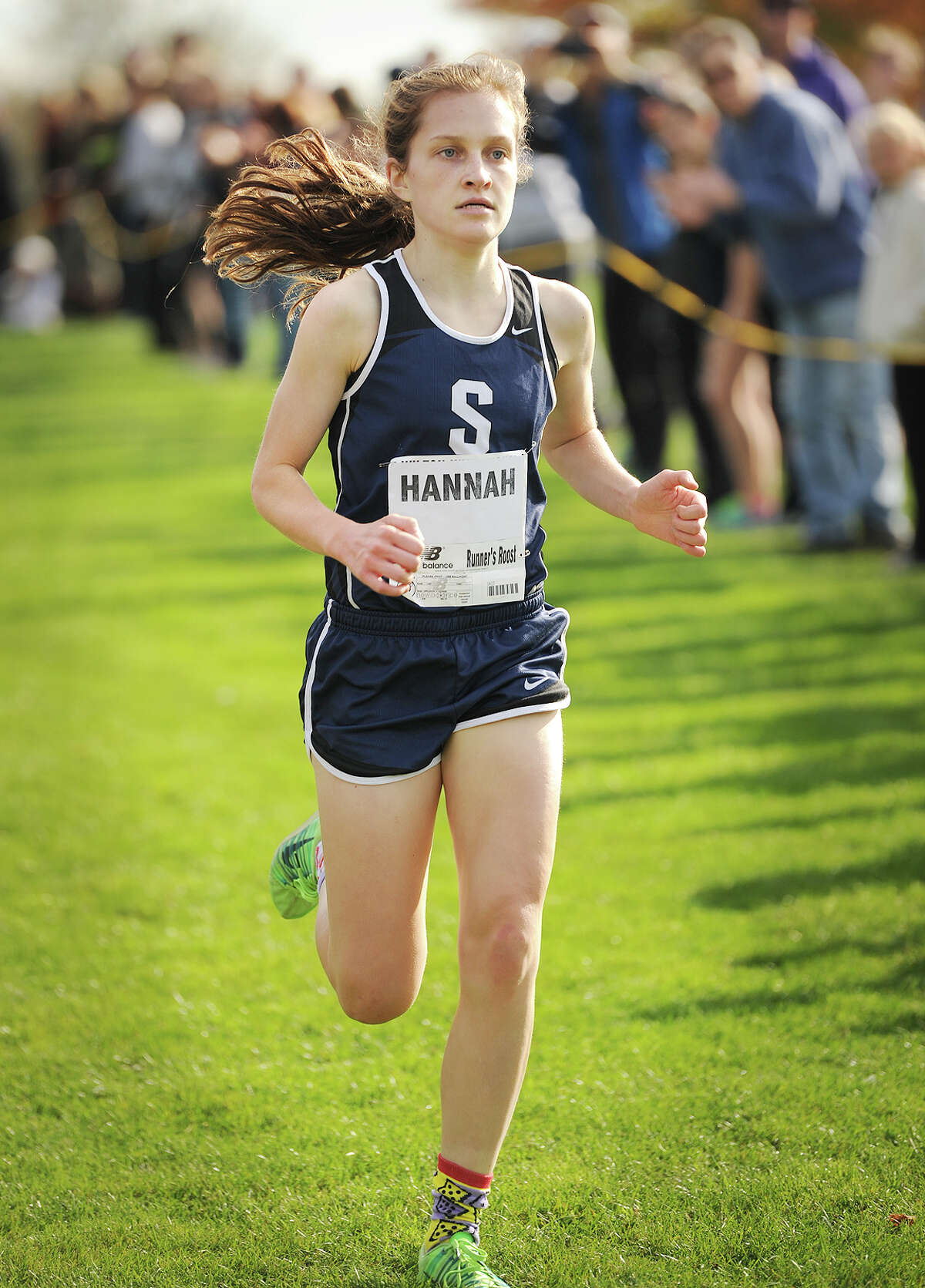 Staples' Hannah DeBalsi races to the finish to win the FCIAC Girls Cross Country Championships at Waveny Park in New Canaan, Conn. on Monday, October 20, 2014.