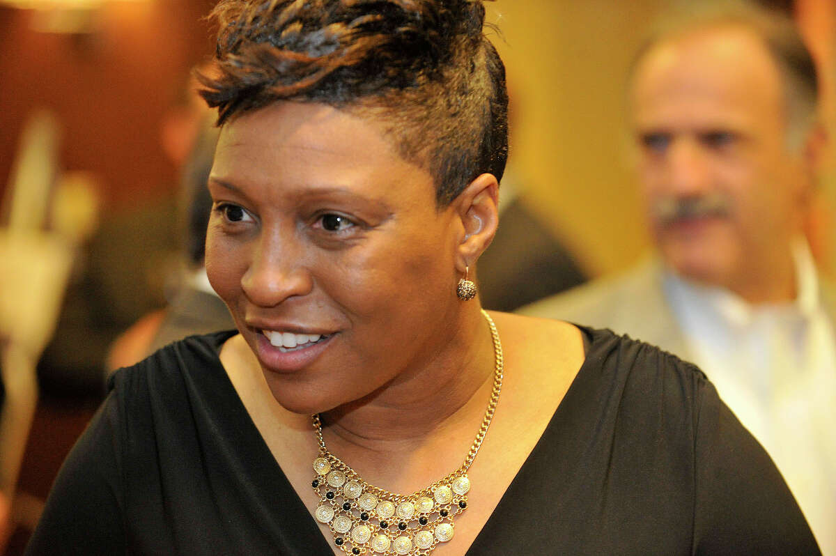 Nadine Domond speaks to a reporter during the Sports Night awards dinner at the Hyatt Regency in Greenwich, Conn., on Monday, Oct. 20, 2014. Domond is being inducted into the Fairfield County Sports Hall of Fame for her basketball skills at Bridgeport Central High School, University of Iowa, the WNBA and as a coach at Grambling State University.