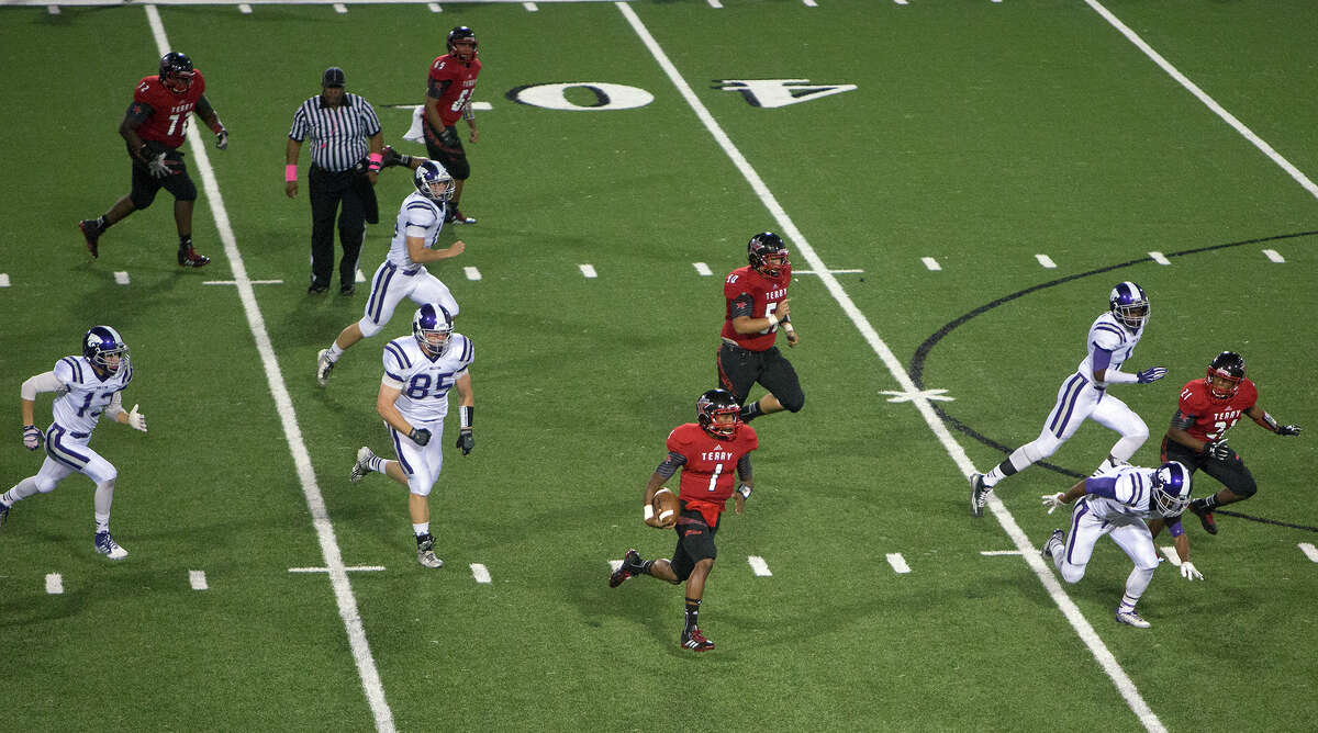 Terry quarterback Drake James, lower center, finds room to run against Angleton's defense. James called the Rangers' split-back veer attack a good fit. "We're very undersized, and we don't have a lot of numbers," he said, "but when it's going well, it looks pretty good."