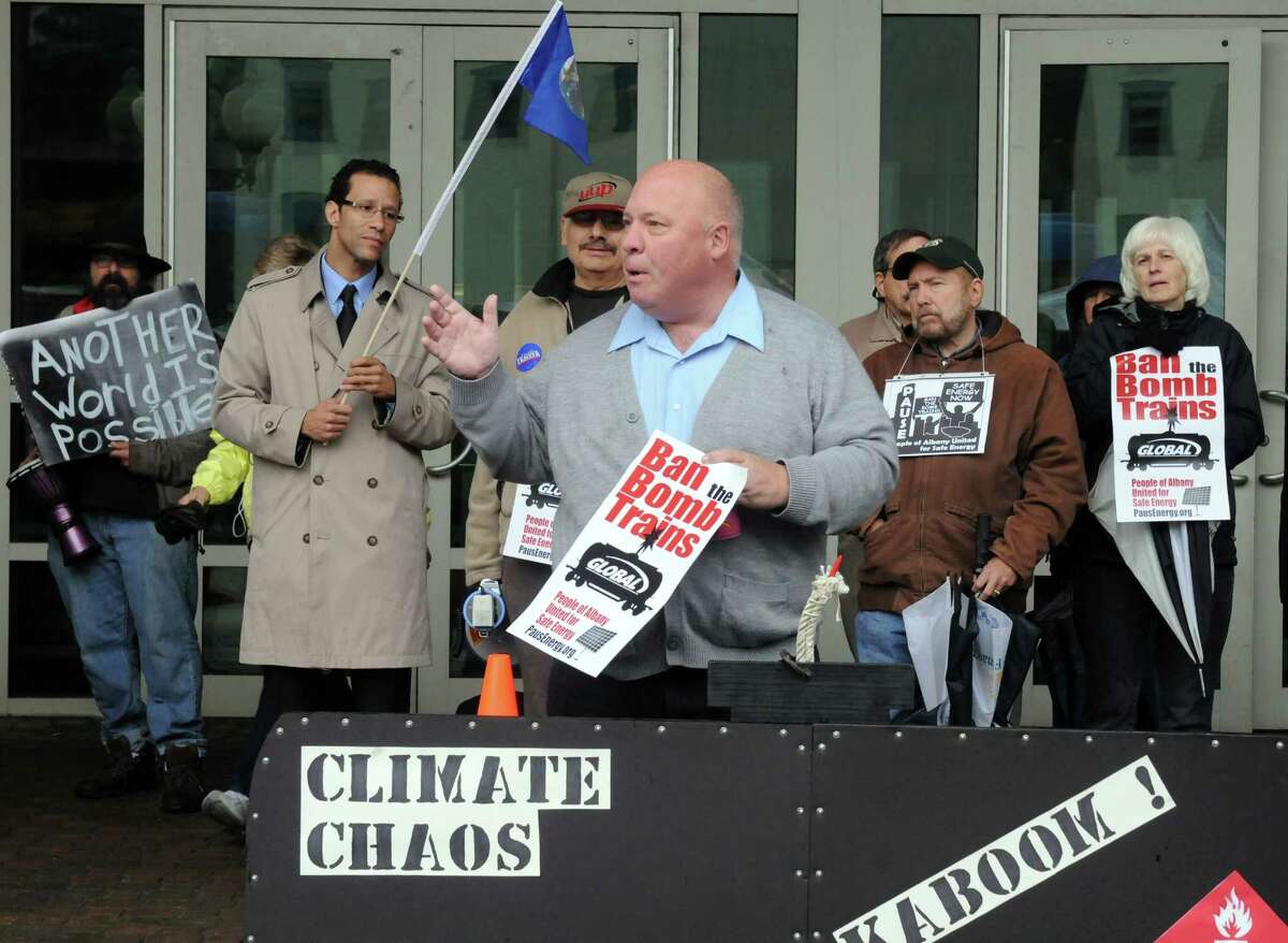 Mark Emanatian of Watervliet joins protesters to denounce the state DEC, for what they claim is a failure to protect the health, safety, and welfare of New Yorkers knowing that the transport of crude oil-by-rail is unsafe, Tuesday Oct. 21, 2014, in front of the DEC offices in Albany, N.Y. Protesters include members of Earthjustice and People of Albany United for Safe Energy (PAUSE). (Michael P. Farrell/Times Union)