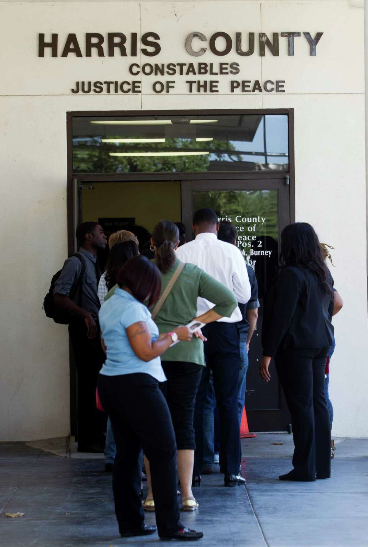 Students from Texas Southern University stand in line at a early voting location after attending a rally encouraging them to get out and vote on Tuesday, Oct. 21, 2014, in Houston. (J. Patric Schneider / For the Chronicle )