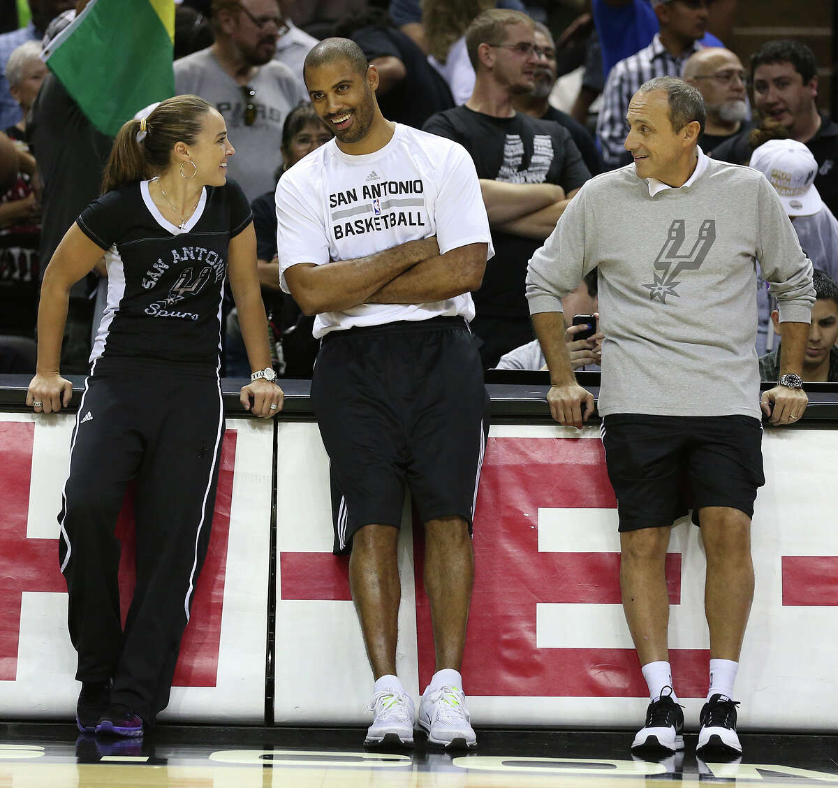 From left, Assistant Coaches Becky Hammon, Ime Udoka and Ettore Messina arrive for the San Antonio Spurs public practice at the AT&T Center, Wednesday, Oct. 1, 2014.