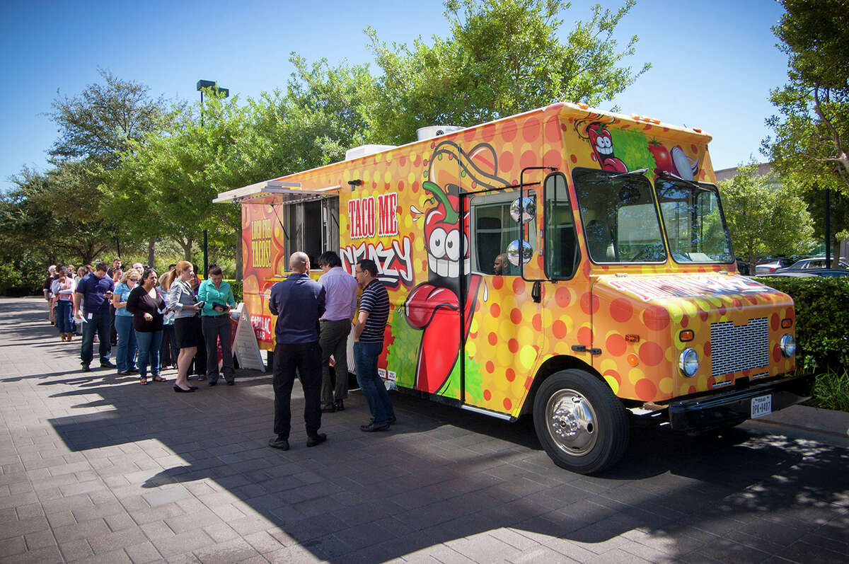 The “Taco Me Crazy” food truck from Rockets owner Tilman Fertitta’s Cadillac Bar served volunteers at the Houston Food Bank on Tuesday.