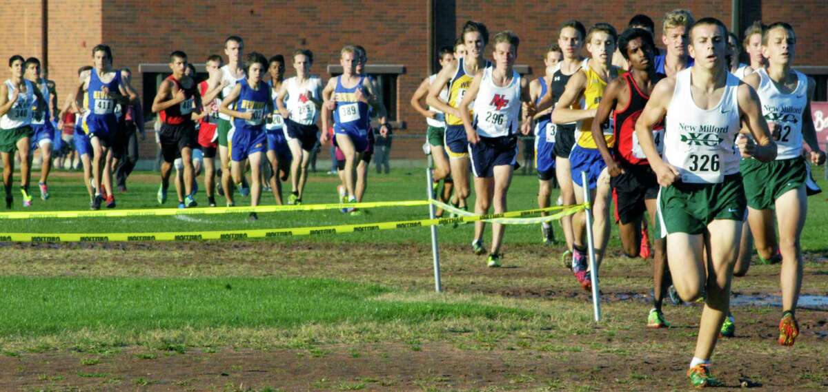 The Green Wave's Stosh Davis quickly grabs a lead he'd never lose en route to the individual title at Oct. 17, 2014's South-West Conference boys' cross country race at Bethel High School. To Stosh's left is teammate Greg Hansell, who finished fourth.