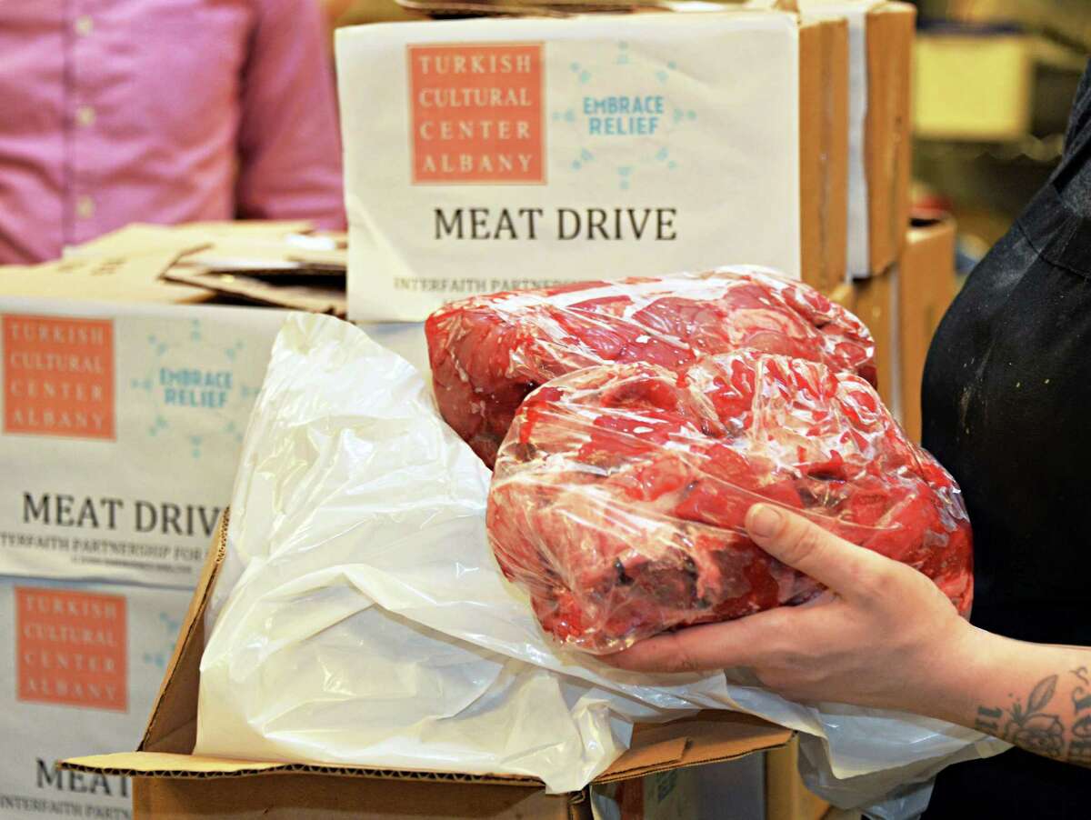 Albany Emergency Center receives 100 pounds of packaged beef cutlets from Turkish Cultural Center Albany for their Meat Drive, dedicated to the Feast of Sacrifice (Eid al Adha) in partnership with Embrace Relief Foundation Wednesday Oct. 22, 2014, in Albany, NY. (John Carl D'Annibale / Times Union)