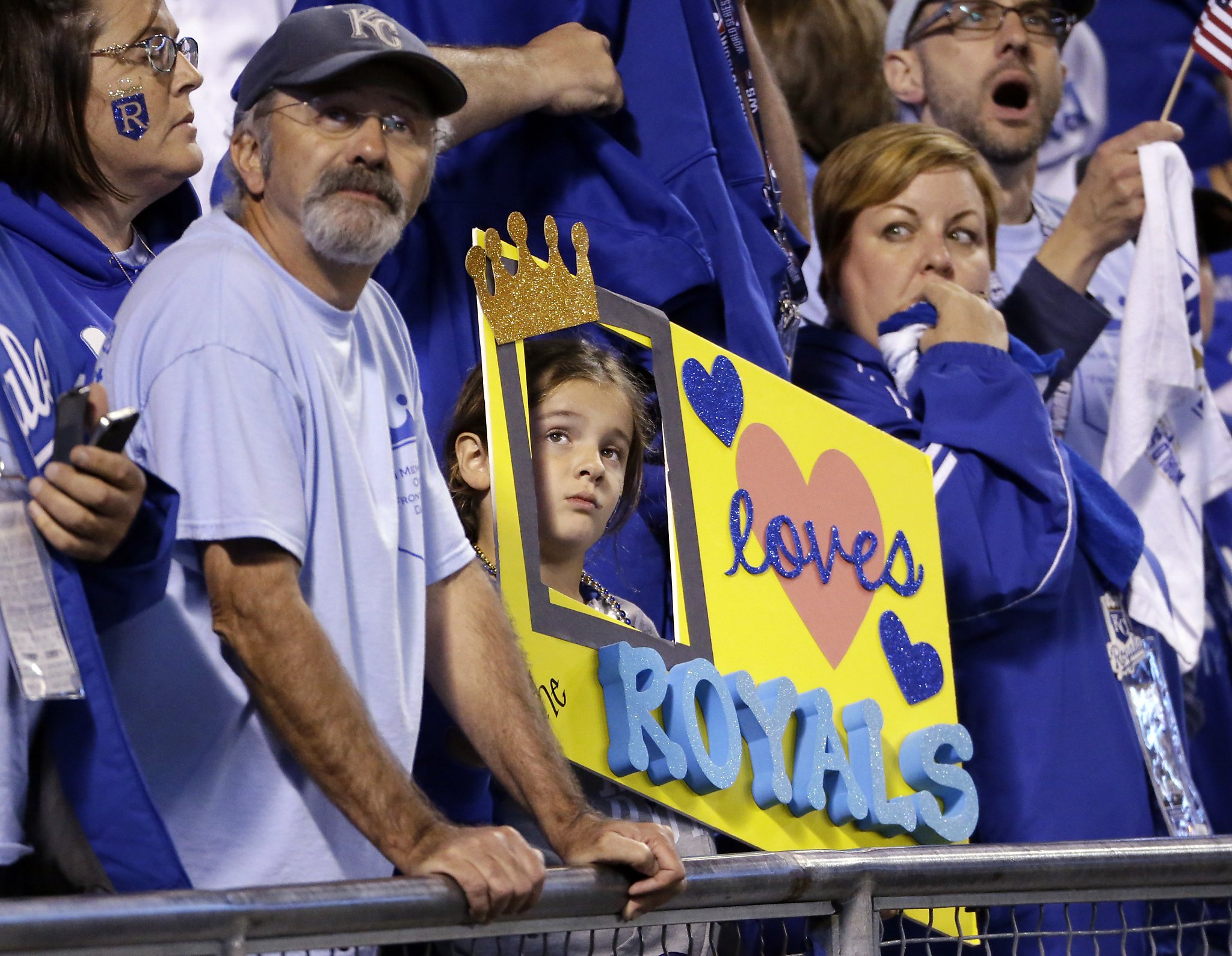 With a Kansas City Royals fan crying, San Francisco Giants third baseman  Pablo Sandoval celebrates the final out against the Royals in game 7 of the World  Series at Kauffman Stadium in