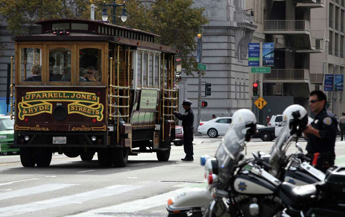 Police investigate a tour bus from Classic Cable Car Charters which hit and killed Priscila “Precy” Moreto on the Polk street side of city hall about 11:30am in San Francisco, Calif., on Thursday, October 23, 2014.