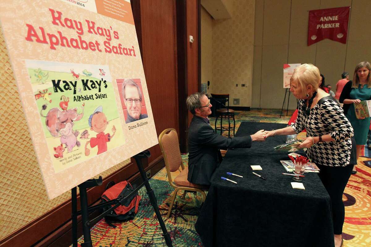Children's literary author Dana Sullivan shakes hands with patron Barbara Haley after signing a book for her at the 23rd Annual San Antonio Express-News Book & Author luncheon at the Marriott Rivercenter on Thursday, Oct. 23, 2014. Proceeds from the event benefit the Cancer Therapy & Research Center (CTRC) Phase I Clinical Research Program.