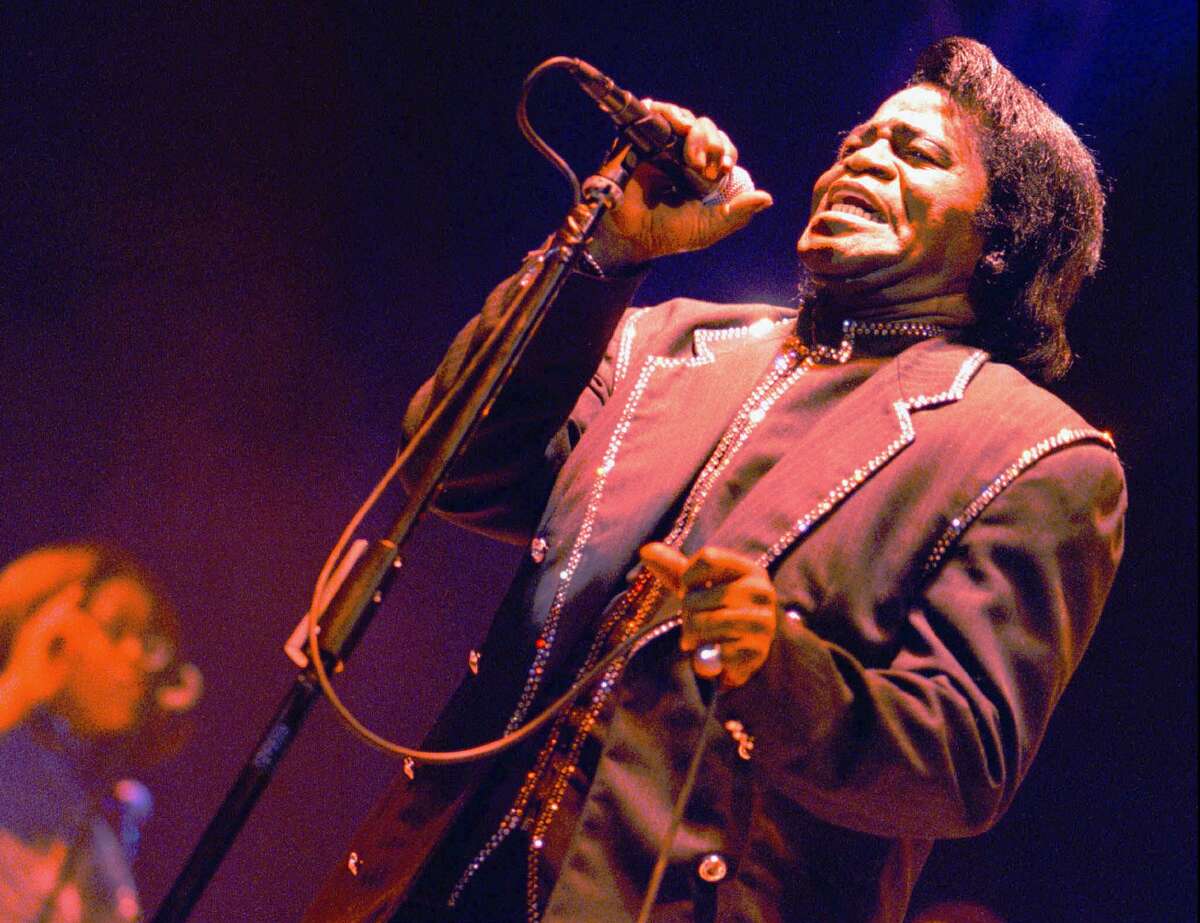 FILE - In this July 5, 1997 file photo, the "Godfather of Soul", singer James Brown, performs during an open air festival in Eschenbach, near Luzern, Switzerland. Rolling Stones frontman Mick Jagger is producing a James Brown documentary, “Mr. Dynamite: The Rise of James Brown,” which airs Monday, Oct. 27, on HBO. (AP Photo/Keystone, Sylvan Mueller, File)
