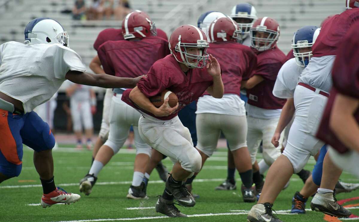 Junior running back Tommy Schmidt from Bethel High School, Bethel, Conn, during a football scrimmage with Danbury High School on Wednesday August 28, 2013, in Danbury Conn.