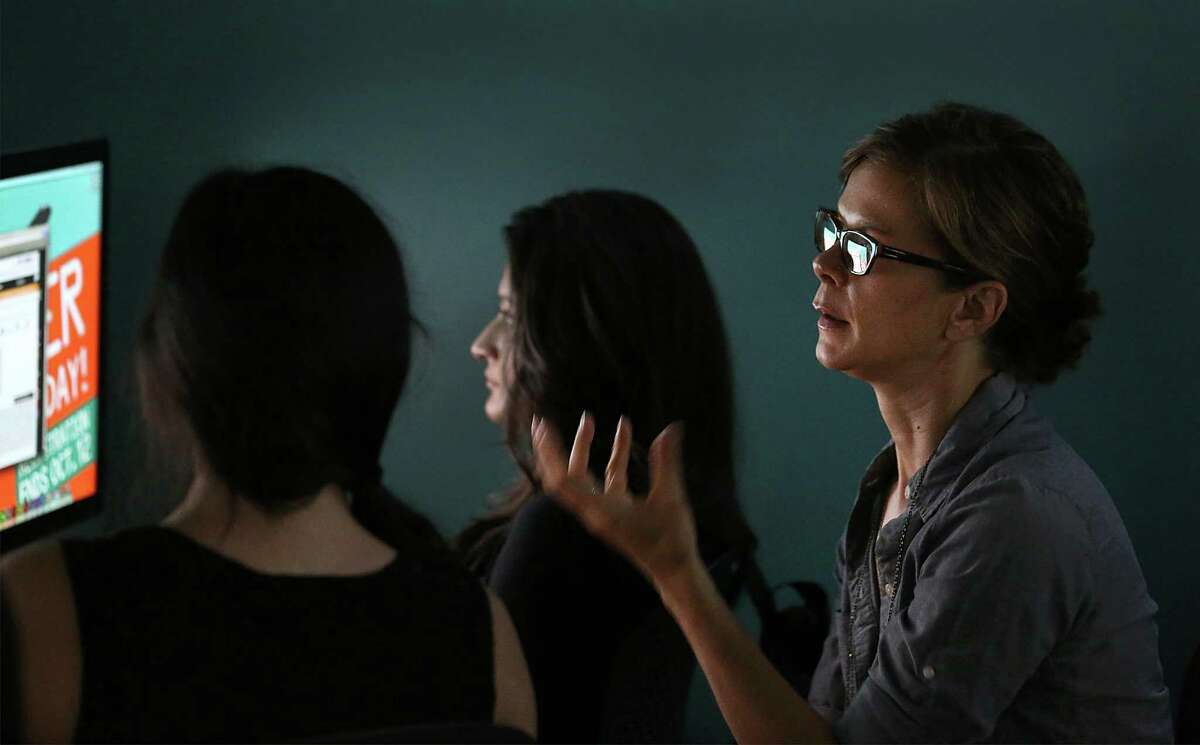 Artist Karen Mahaffy, pictured with her students at Palo Alto College, explores the idea of home in her video and installation work.