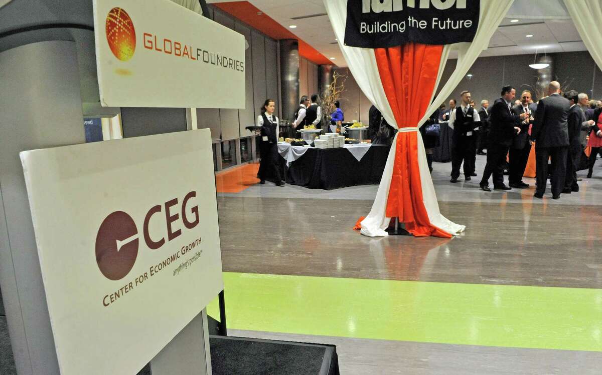 Attendees at the CEG's annual meeting at Fab 8 at GlobalFoundries take part in the reception on Thursday evening, Oct. 23, 2014, in Malta, N.Y. (Paul Buckowski / Times Union)