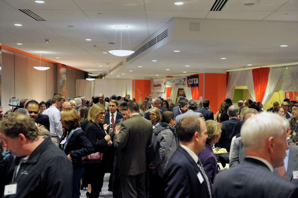 Attendees at the CEG's annual meeting at Fab 8 at GlobalFoundries take part in the reception on Thursday evening, Oct. 23, 2014, in Malta, N.Y. (Paul Buckowski / Times Union)