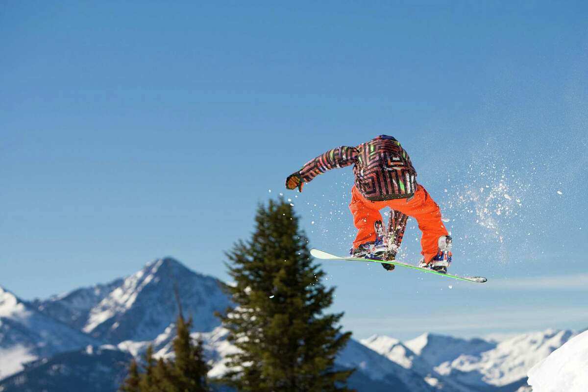 Snowboarder Robert Blank launches off a cornice in Vail's Sun Down Bowl.