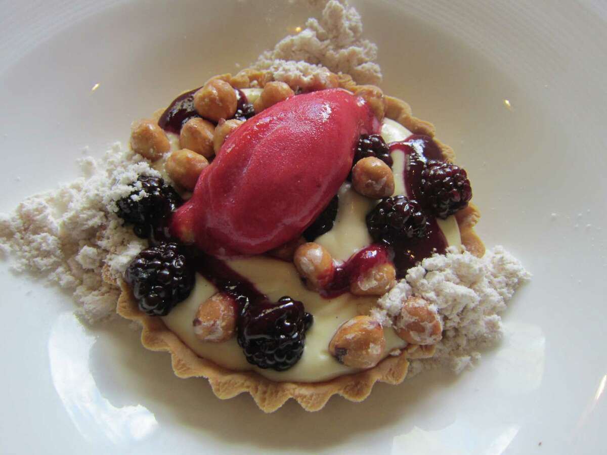 Violet, Blackberry & Almond Tart with powdered praline and raspberry sorbet is one of the dessert options at Sweet Basil restaurant in Vail, Colo. shot Sept. 2014