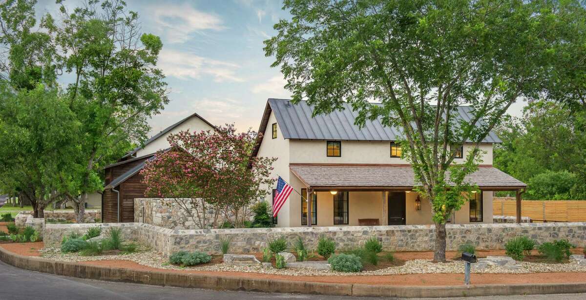 A renovation by Laughlin homes in Fredericksburg created a separate house behind the main house.