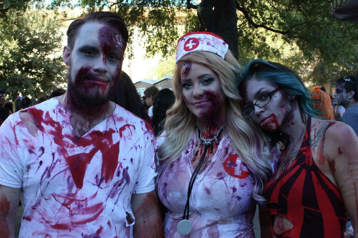 Thousands of San Antonio ghouls hit HemisFair Park Sunday afternoon and walked the streets of downtown to Alamo Plaza for the 2014 San Antonio Zombie Walk.