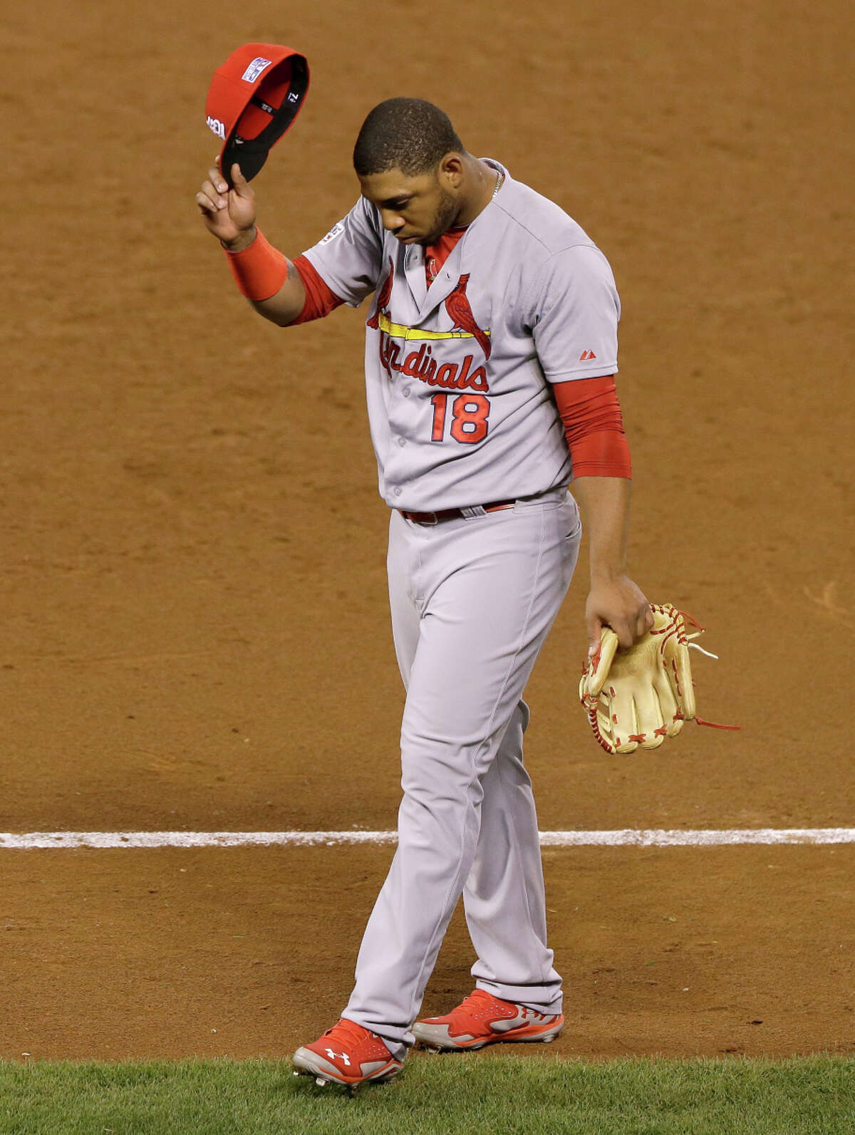 St. Louis Cardinals outfielder Oscar Taveras enters the clubhouse