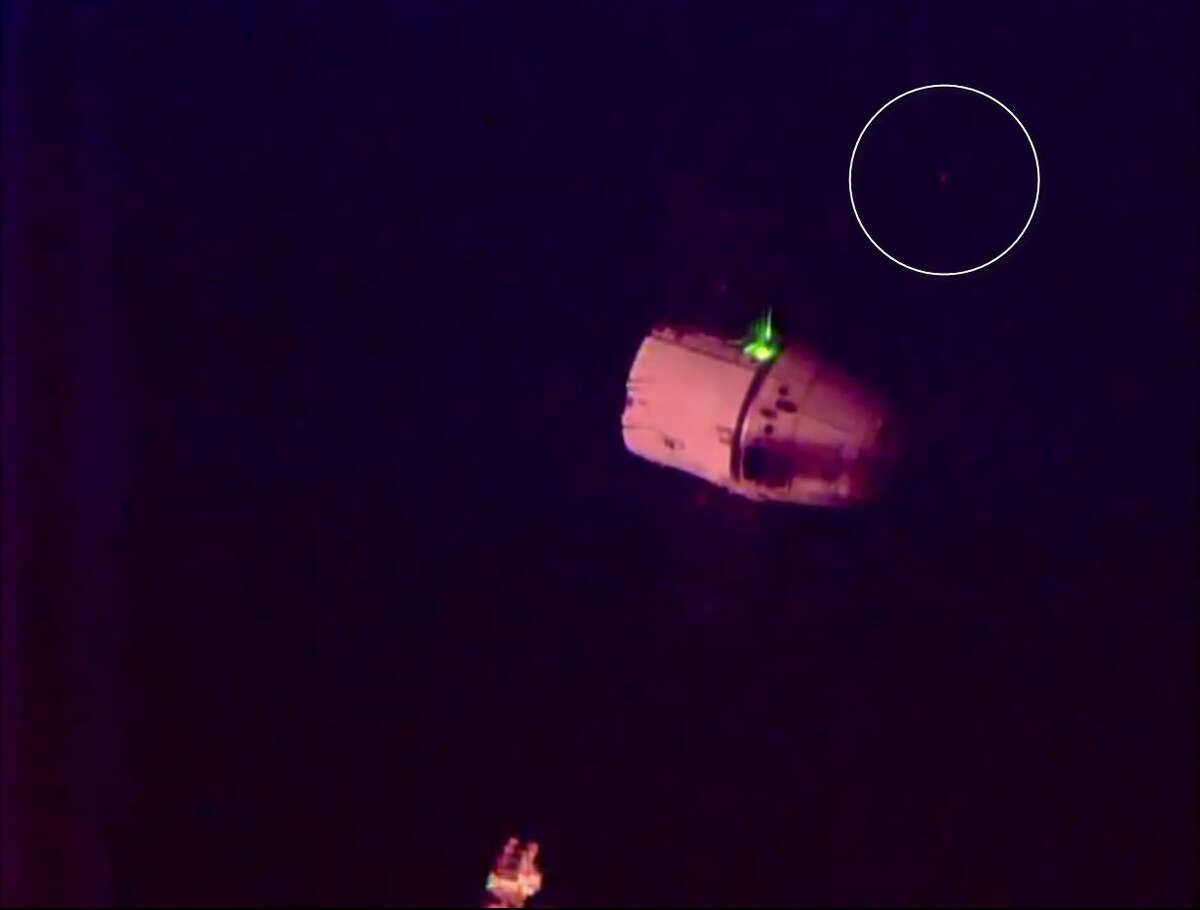 A blinking light behind a Space X cargo ship disembarking from the International Space Station gave UFO conspiracy theorists something to chatter about.