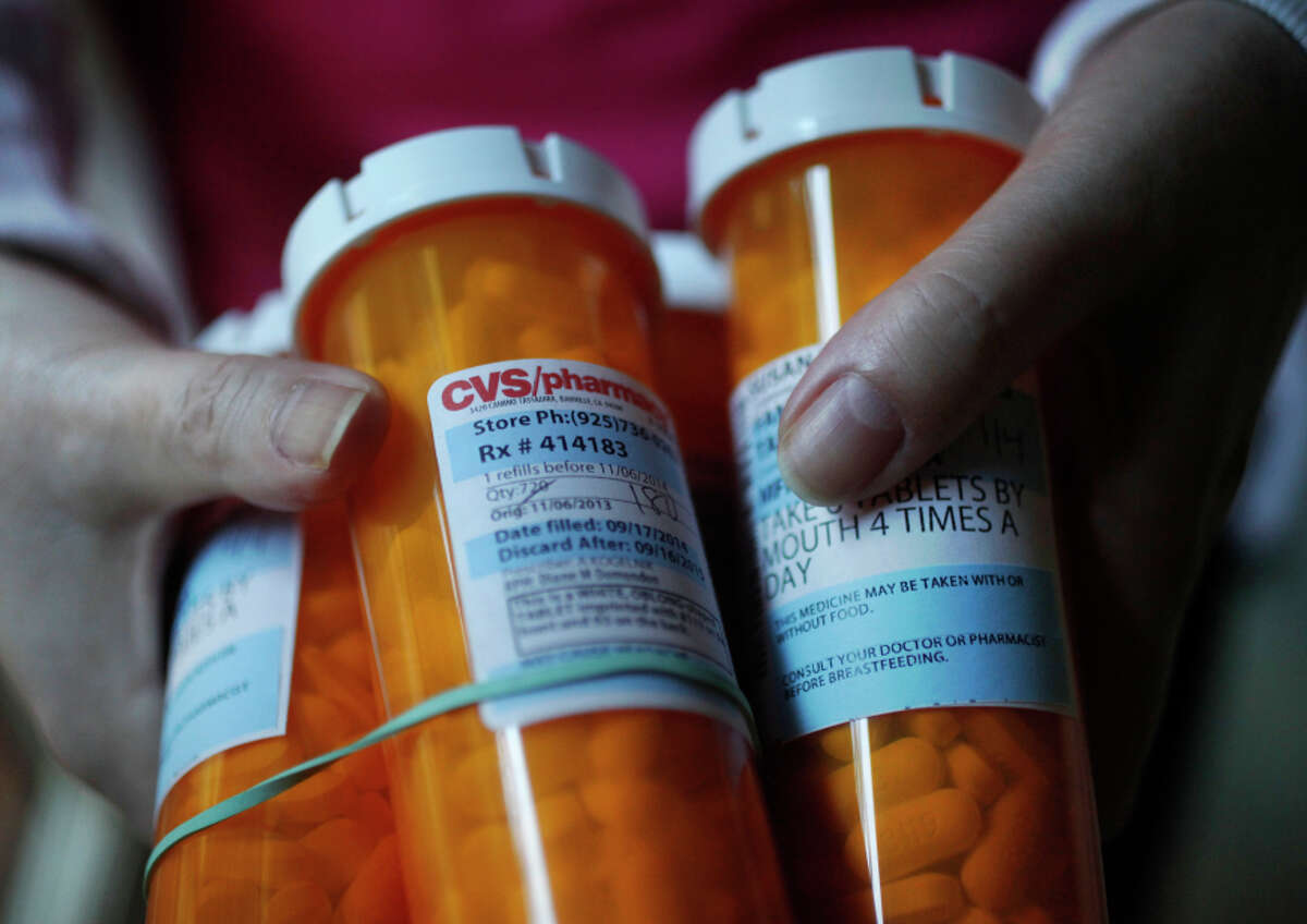 Kreutzer, 58, holds a month’s worth of her antiviral pills in her home Oct. 25, 2014 in Danville, Calif. Kreutzer says she feels like her life has been stolen from her since she came down with what she thought was the flu in 1991. A young lawyer at the time, she toughed it out for months, but she never seemed to recover. Over the past few years, she has oscillated between really sick and somewhat sick but always exhausted. She's seen doctors and specialists over the years, mostly concerning her thyroid, which she had removed once it was discovered it had cancer in 2006. Kreutzer never fully recovered and in fact got worse in 2008. That was the first time she started timidly asking about Chronic Fatigue Syndrome, knowing the term had a stigma attached to it. Doctors told her not to go there, but she was desperate for answers, "my life is ending," she thought. Finally, in 2012, she found a doctor who was willing to give her antiviral drugs associated with the mysterious illness. At the time, she was only awake about three hours of the day and the sleep she did get was restless. "There's fatigue, but this is not regular fatigue," she said, "this is beyond any kind of fatigue you've ever experienced." 10 weeks to the day of starting the antivirals, she says she "rose from the dead". For the first time in years, she was starting to feel good again. But in Kreutzer's excitement in feeling better, she wore her body out quickly and fell ill again. She's now in a stable enough place that she plans to start taking the antiviral drugs again and is hoping for "remission" from the illness she prefers to call Myalgic Encephalomyelitis.