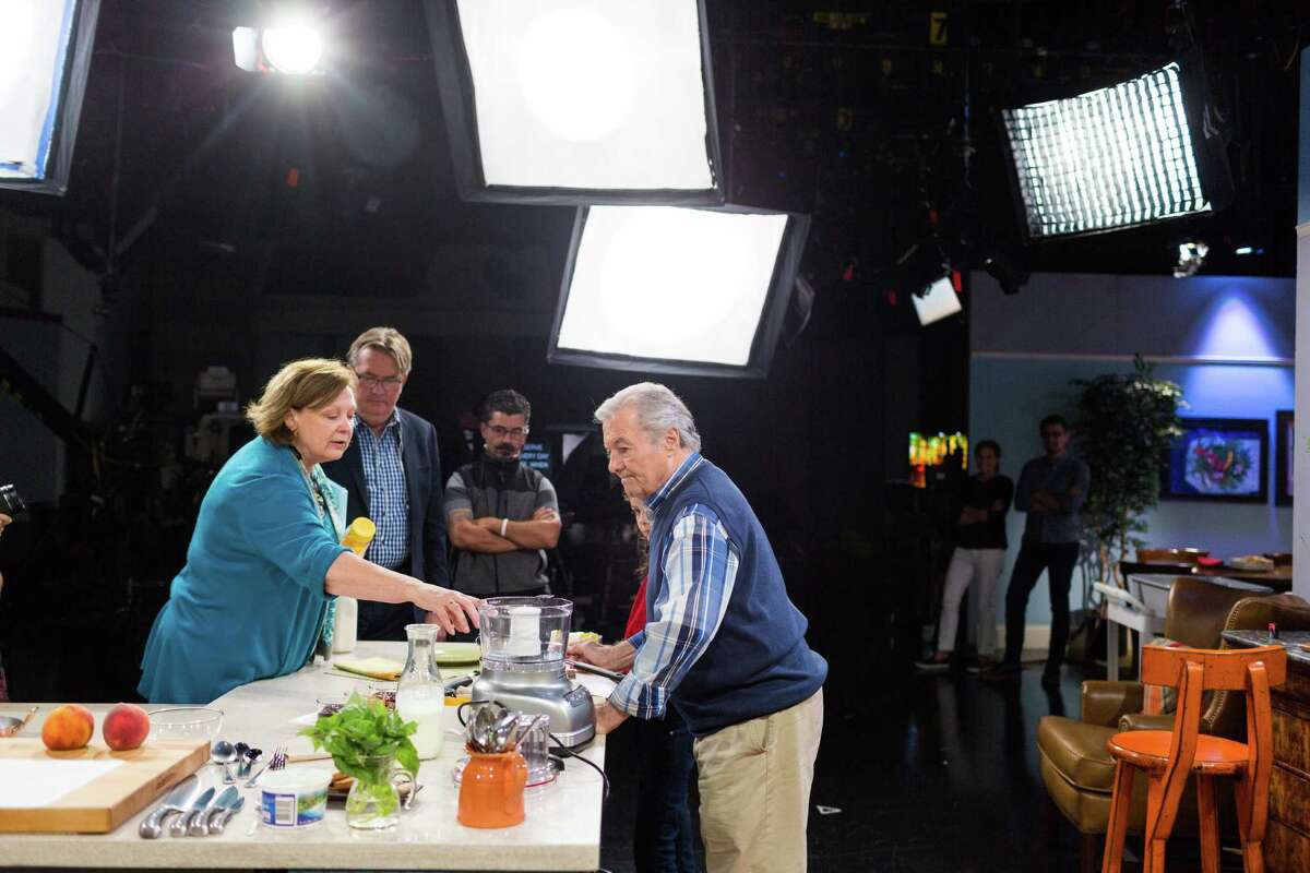 Jacques Pepin, the French chef and host of KQED's "Heart and Soul" cooking show, talks with producer Tina Salter before taping at KQED in San Francisco, Calif., Monday, October 13, 2014.