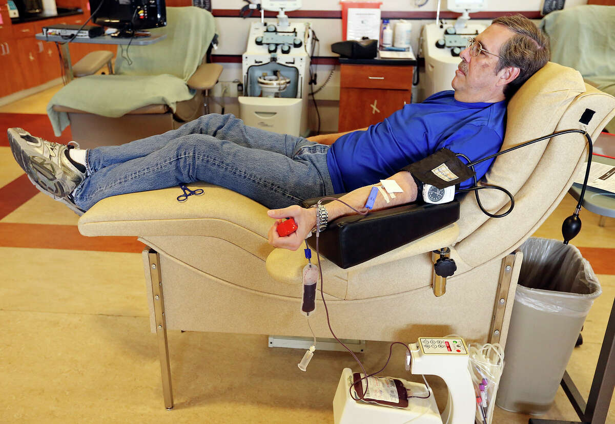 Craig Allen, 61, donates whole blood Saturday Oct. 11, 2014 at Donor Pavilion of the South Texas Blood & Tissue Center.