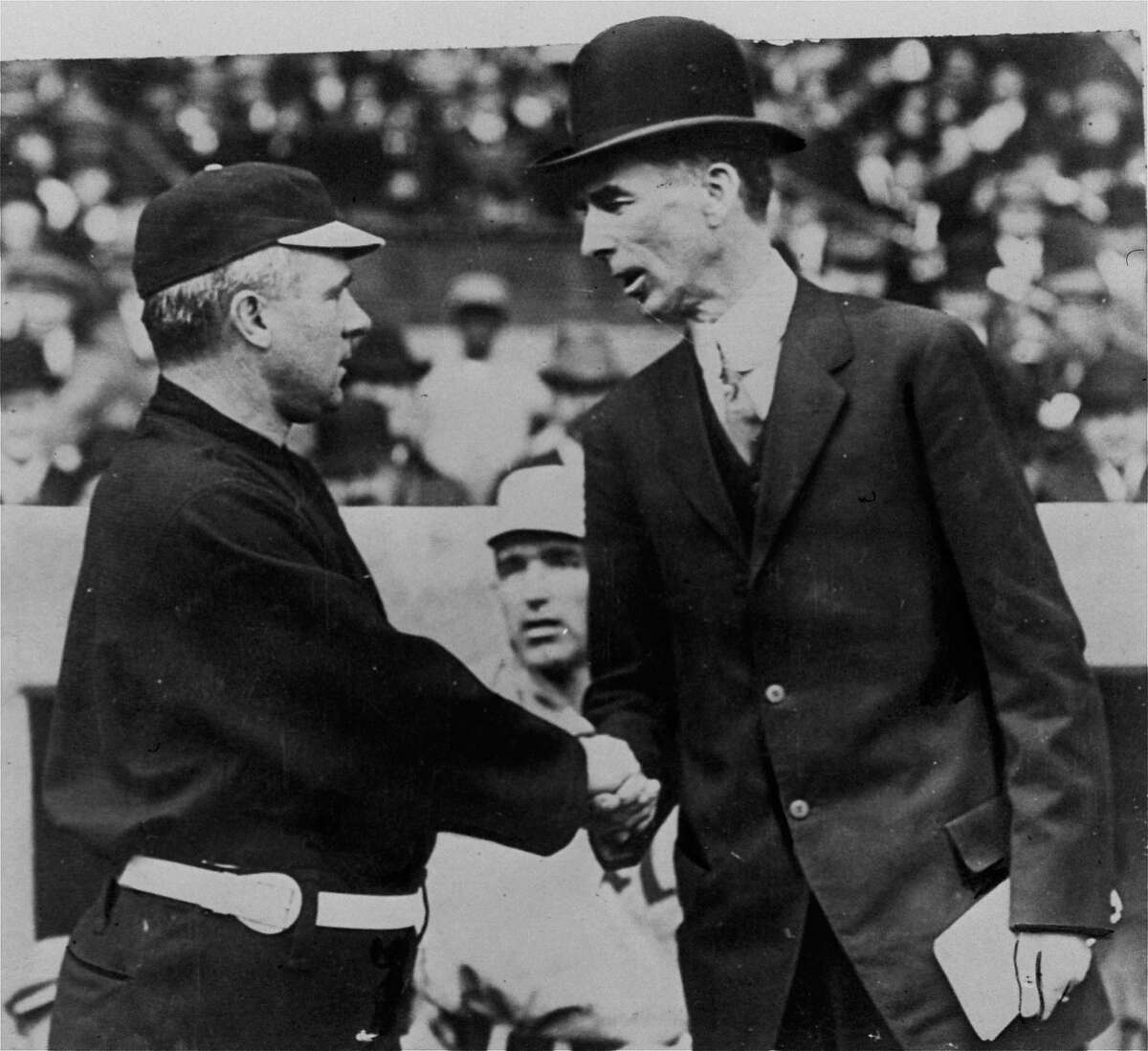 1911: Opposing managers Connie Mack, right, and John McGraw, at the opening game of the 1911 World Series, New York City, October 14, 1911. Mack's Philadelphia Athletics defeated McGraw's New York Giants in 6 games.