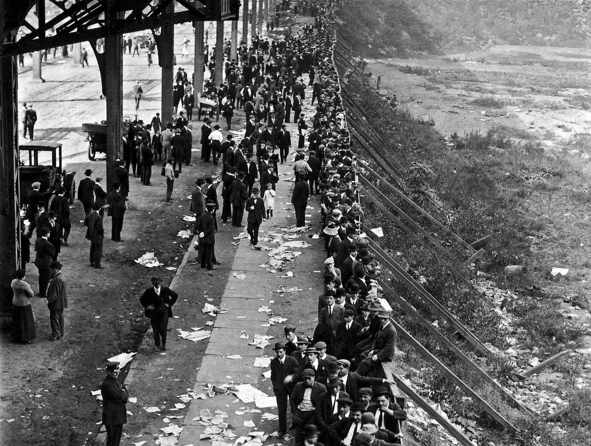 1912: Fans waiting in line at the Polo Grounds for tickets for the first game of the 1912 World Series between the New York Giants and the Boston Red Sox, New York, New York, October 7, 1912.  The Giants won Game 6 5-2 and evened the series with an 11-4 blowout in Game 7, but lost the title in the eighth game when the Red Sox scored twice in the bottom of the 10th.