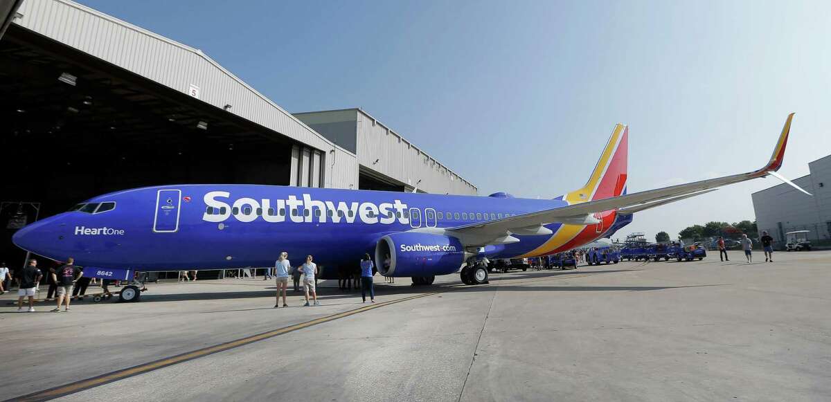 A Southwest Airlines plane sporting the newly unveiled paint color scheme sits outside a hanger at Love Field. Southwest will begin nonstop service from San Antonio to Mexico City on Sunday, taking over the route previously operated by AirTran Airways.